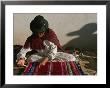 A Bolivian Woman Weaves Brightly Colored Fabric On A Loom by Kenneth Garrett Limited Edition Print