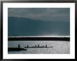 Fishermen Paddle An Outrigger In Wailua Bay On The North Shore Of Oahu, Haleiwa, Hawaii, Usa by Lawrence Worcester Limited Edition Print