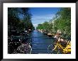 Yellow Bicycle And Canal, Amsterdam, Netherlands by Nik Wheeler Limited Edition Print