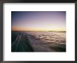 A View From A Speeding Boat As It Leaves A Wake At Twilight by Skip Brown Limited Edition Print