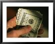 Hand Holds A Wad Of American Hundred Dollar Bills by Stephen Alvarez Limited Edition Pricing Art Print