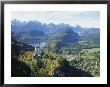 Neuschwanstein And Hohenschwangau Castles, Alpsee And Tannheimer Alps, Allgau, Bavaria, Germany by Hans Peter Merten Limited Edition Print