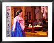 Woman In Costume Performing For Table Of Men Dining At Sanchon, Insadong, Seoul, South Korea by Anthony Plummer Limited Edition Print