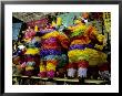 Several Brightly-Colored Pinatas Await Buyers In A Mexican Market by Stephen St. John Limited Edition Print