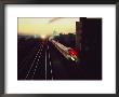 A Trans-Canada Railway Train Rushes Down The Tracks At Dusk by Paul Chesley Limited Edition Print