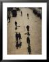 People Walk Along The Bund Casting Shadows by Eightfish Limited Edition Print
