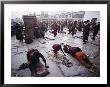 Buddhist Pilgrims Outside Jokhang Temple In Lhasa, Tibet by Gordon Wiltsie Limited Edition Print