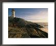 A Twilight View Of The Peggys Cove Lighthouse Atop Smooth Rock by Michael S. Lewis Limited Edition Print
