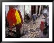 Man Hangs Dyed Wool In The Medina, Fes, Morocco by John & Lisa Merrill Limited Edition Print