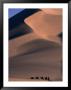 Camel Caravan Traveling Through Taklimakan Desert With Large Sand Dunes In Background, China by Keren Su Limited Edition Print