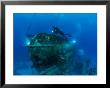 A Diver Swims Around The Submerged Research Station, Aquarius by Brian J. Skerry Limited Edition Pricing Art Print