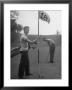 Son Cary Caddying For His Father by Nina Leen Limited Edition Print