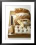 Assorted Loaves On Wooden Chopping Board by Michael Paul Limited Edition Pricing Art Print