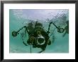 Photographer With Camera Underwater With Diving Moken Tribesmen by Nicolas Reynard Limited Edition Print