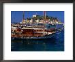 Wooden Yachts Moored In Front Of Pigeon Island, Kusadasi, Turkey by Wayne Walton Limited Edition Print