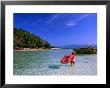 Woman With Red Sarong Enjoying Sea, Krabi, Thailand by Juliet Coombe Limited Edition Print