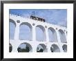 Santa Teresa Bondinho (Tram) Travelling Over A Bridge, Rio De Janeiro, Brazil, South America by Marco Simoni Limited Edition Pricing Art Print