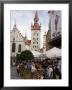 People Sitting At An Outdoors Cafe In Front Of The Old City Hall, Munich, Bavaria, Germany by Yadid Levy Limited Edition Print
