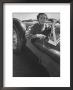 Well Dressed Woman Behind The Wheel Of A Foreign Made Roadster by Nina Leen Limited Edition Print