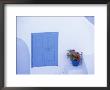 Architectural Detail Of Blue And White House, With Pot Of Geraniums, Oia (Ia), Aegean Sea, Greece by Sergio Pitamitz Limited Edition Print