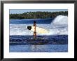 Young Local Boy On Reef Heading Out For Afternoon Surf, Lagundri Bay, Indonesia by Paul Kennedy Limited Edition Print