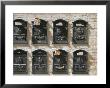 Mailboxes Lined On A Stone Wall, Ravenna, Italy by Gina Martin Limited Edition Print