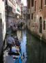 Gondoliers Escort Tourists Through Canals Of San Marco, Venice, Italy by Robert Eighmie Limited Edition Print