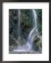 Waterfall With Wet Rocks And Pebbles Taken From Beach, Cornwall, England, United Kingdom by Roy Rainford Limited Edition Print