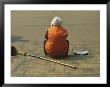 A Chinese Person Rests On A Street Curb After Sweeping The Sidewalk by Todd Gipstein Limited Edition Print