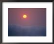 View Of Rising Sun Above Surf by Raul Touzon Limited Edition Print