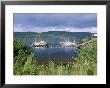 Rainbow Arcs Above Sailboats Moored In Thorne Bay, Alaska by Rich Reid Limited Edition Print
