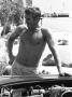 Actor Steve Mcqueen Standing Beside Open Hood Of Car by John Dominis Limited Edition Print