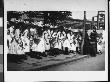 A Group Of Girls Dressed In White Dresses With Sashes And Flower-Covered Hats For Children's Day by Wallace G. Levison Limited Edition Print