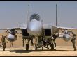 Us Crewmen Checking An F-15 Fighter's Sidewinder Missiles At An Airfield by Dennis Brack Limited Edition Print