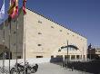 Palacio De Congresos Y Exposiciones With Motorcycles And Flags Seen From Plaza De San Bartholome by David Borland Limited Edition Print