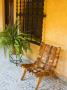 Leather Chair In Courtyard, San Miguel De Allende, Guanajuato State, Mexico by Julie Eggers Limited Edition Print