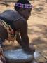 Young Girl Grinding Corn, Shakaland, Kwazulu Natal, South Africa by Lisa S. Engelbrecht Limited Edition Print