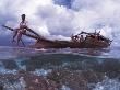 Bajau Fisherman On Lepa Boat In Shallow Water Over Coral Reef, Pulau Gaya, Borneo, Malaysia by Jurgen Freund Limited Edition Print