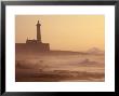 Lighthouse At Sunset With Crashing Waves, Morocco by John & Lisa Merrill Limited Edition Pricing Art Print