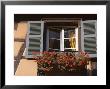 Close-Up Of Typical Window With Blue Shutters And Windowbox Full Of Geraniums, France by Guy Thouvenin Limited Edition Print