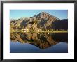 Golfers Framed By The Santa Rosa Mountains While Playing A Round At The Eldorado Country Club by Ralph Crane Limited Edition Pricing Art Print