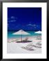 Beach Chairs And Umbrellas On Long Bay Beach by Richard I'anson Limited Edition Print