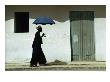 Man Walking With Umbrella, St. Louis, Senegal by Eric Wheater Limited Edition Print