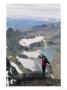 A Mountaineer Coils His Rope On Mt. Gould In Glacier National Park by Gordon Wiltsie Limited Edition Print