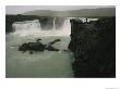 A Lone Visitor Watches The Cascades Of Godafoss Waterfall by Sisse Brimberg Limited Edition Print