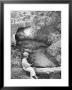 Little Boy Sitting On A Felled Tree, Fishing by Cornell Capa Limited Edition Print