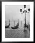 Moored Gondolas On A Foggy Grand Canal With Santa Maria Della Salute Church In The Background by Dmitri Kessel Limited Edition Print