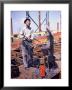 War Worker Holding Red Hot Metal Piece With Tongs At Shipyard by George Strock Limited Edition Print