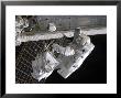 Astronaut Participates In Extravehicular Activity On The International Space Station by Stocktrek Images Limited Edition Pricing Art Print