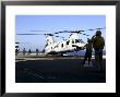 Personnel Walk Into The Rear Of A Ch-46E Sea Knight Helicopter by Stocktrek Images Limited Edition Pricing Art Print